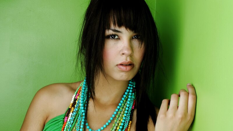 woman with colorful necklaces