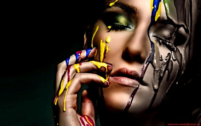 woman with colorful paint on face