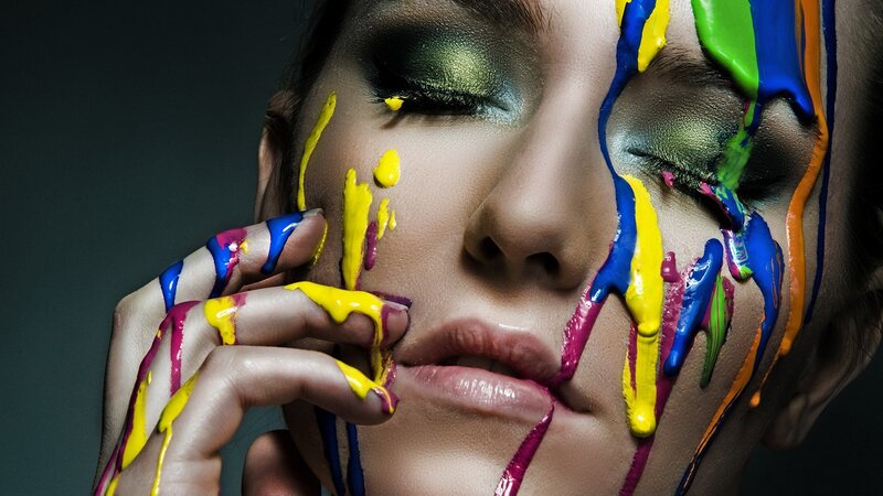 woman with colorful paint on face