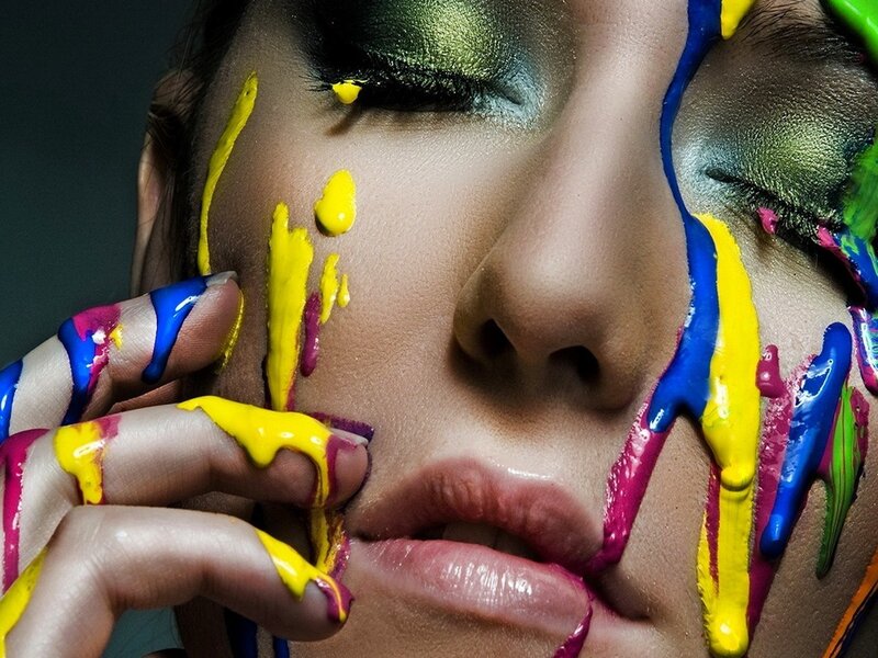 woman with colorful paint on face