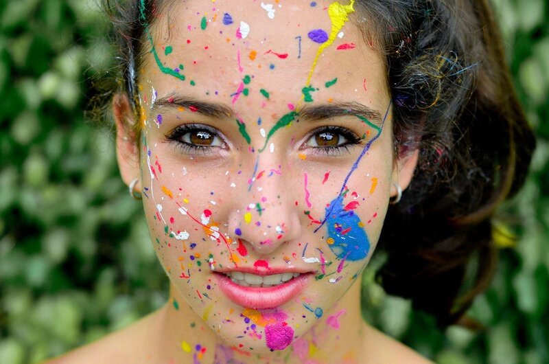woman with colorful paint on face