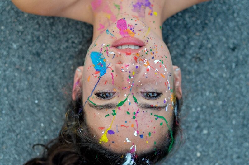woman with colorful paint on face