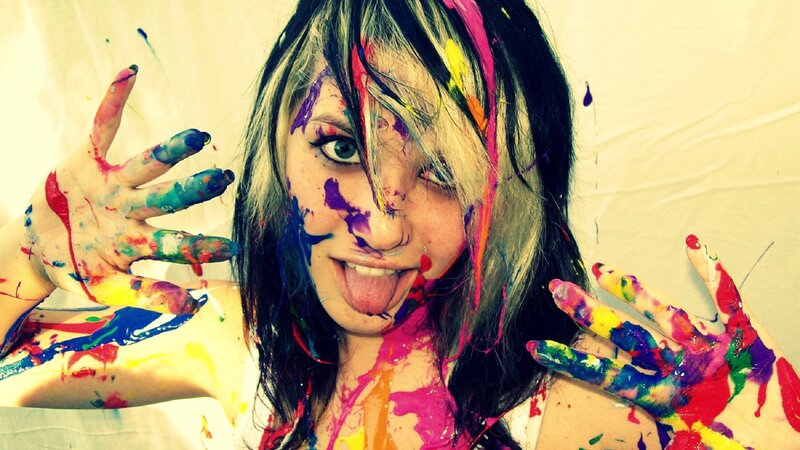 woman with colorful paint on hands