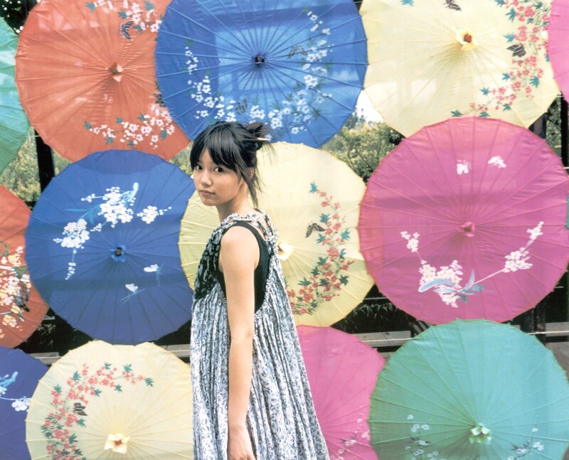 woman with colorful parasols