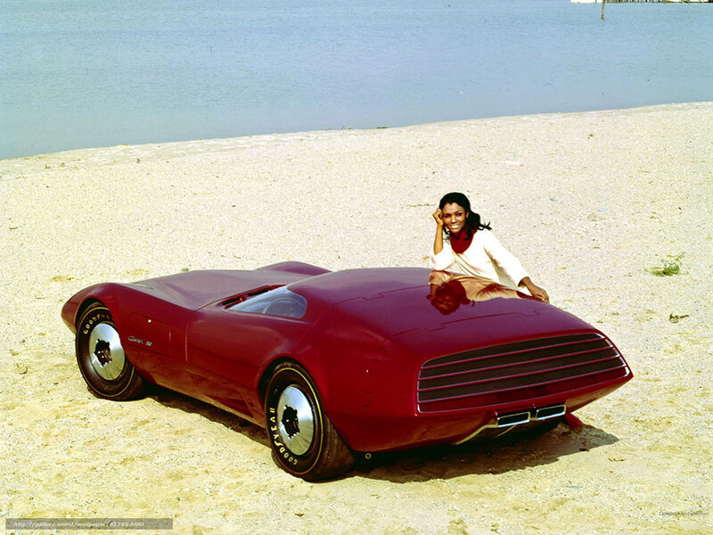Woman with concept car on beach