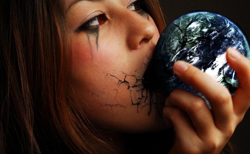 woman with cracked earth globe