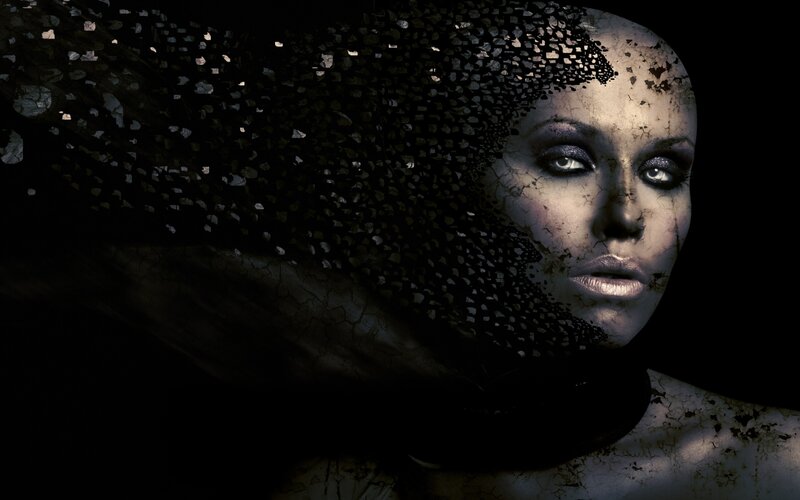 woman with cracked face and veil