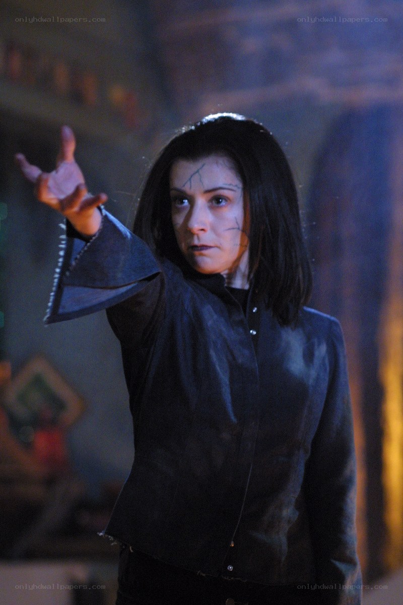 woman with cracked face casting spell