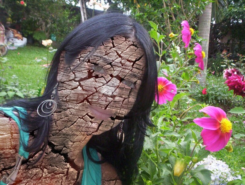 woman with cracked face in garden