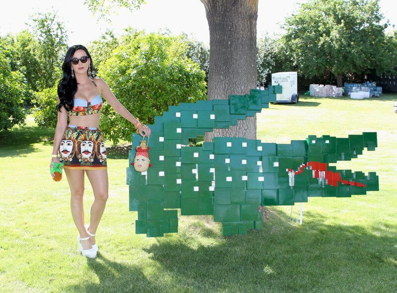 Woman with crocodile sculpture