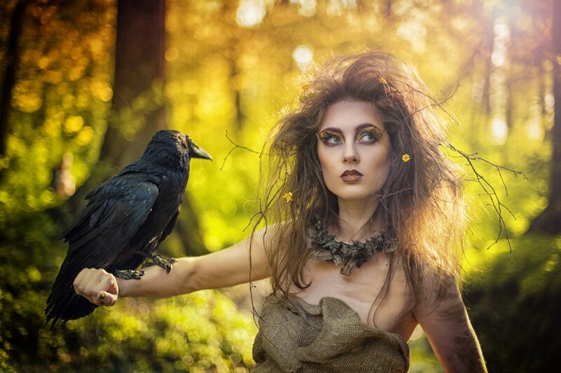 Woman with Crow in Forest — Green, Dramatic