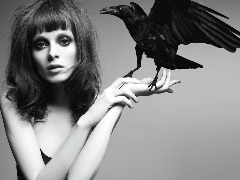 woman with crow on hand
