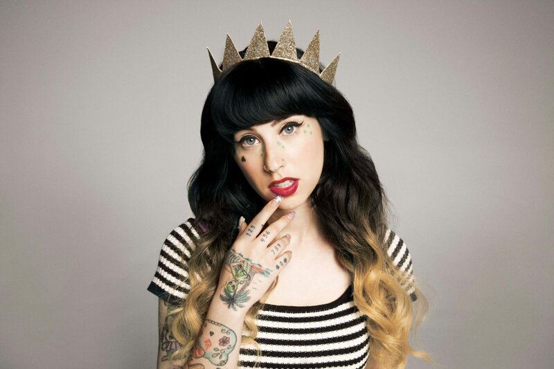 woman with crown and tattoos