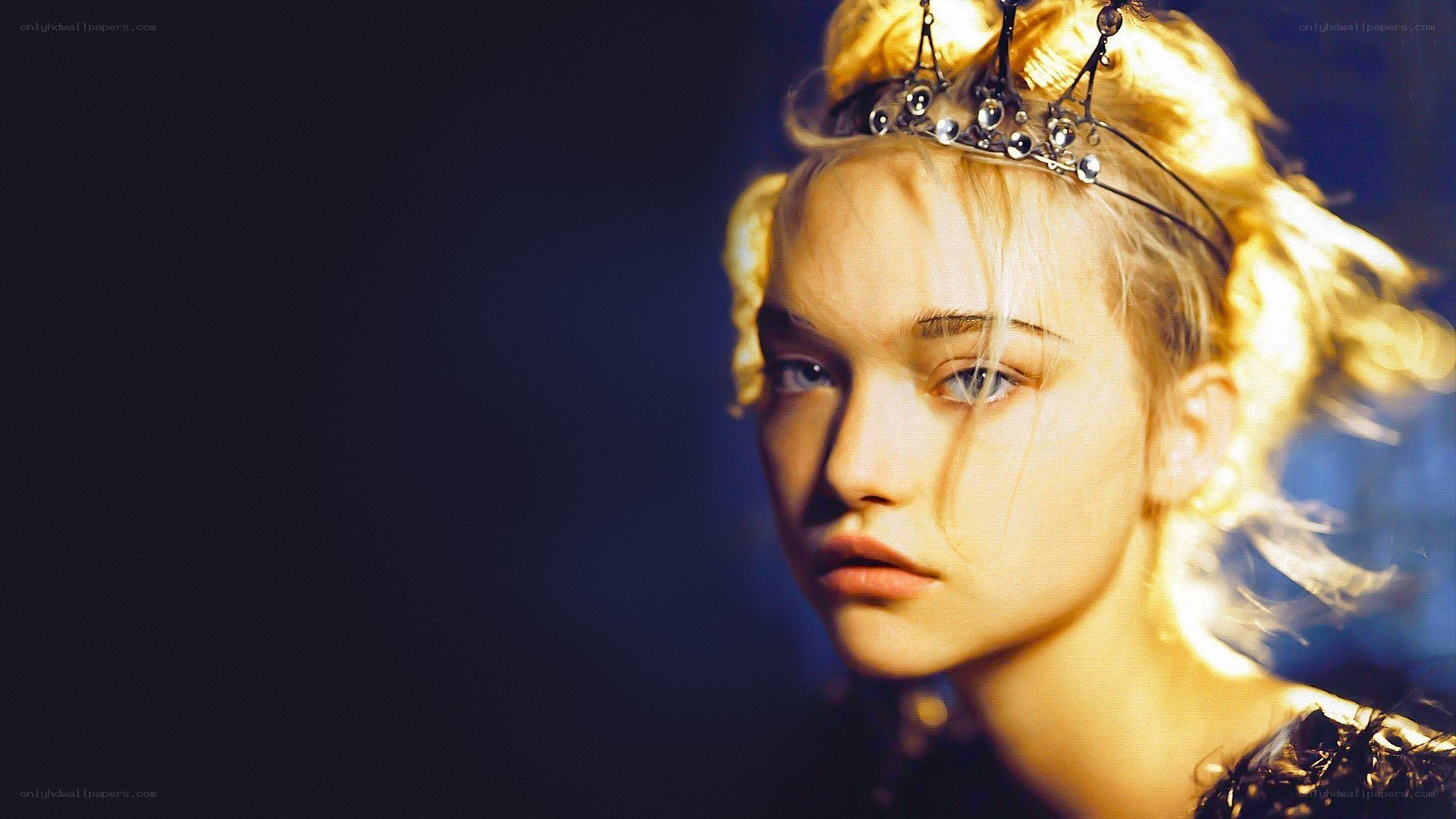 woman with crown in dramatic lighting