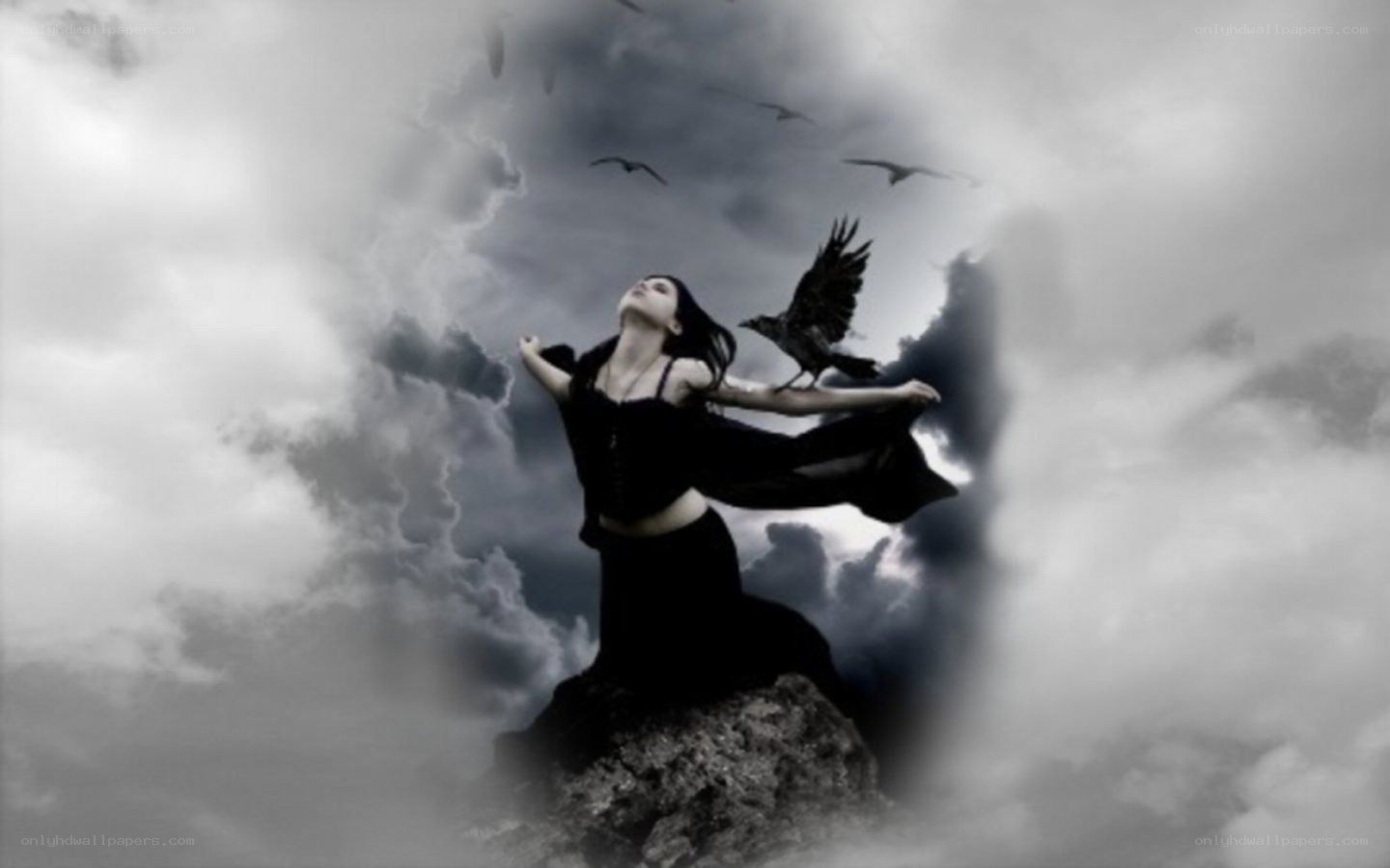 woman with crows on cliff