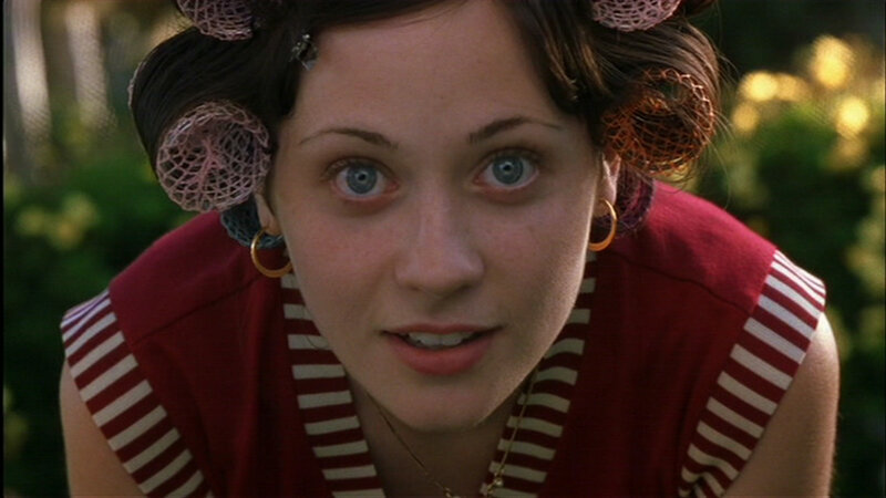 woman with curlers in garden