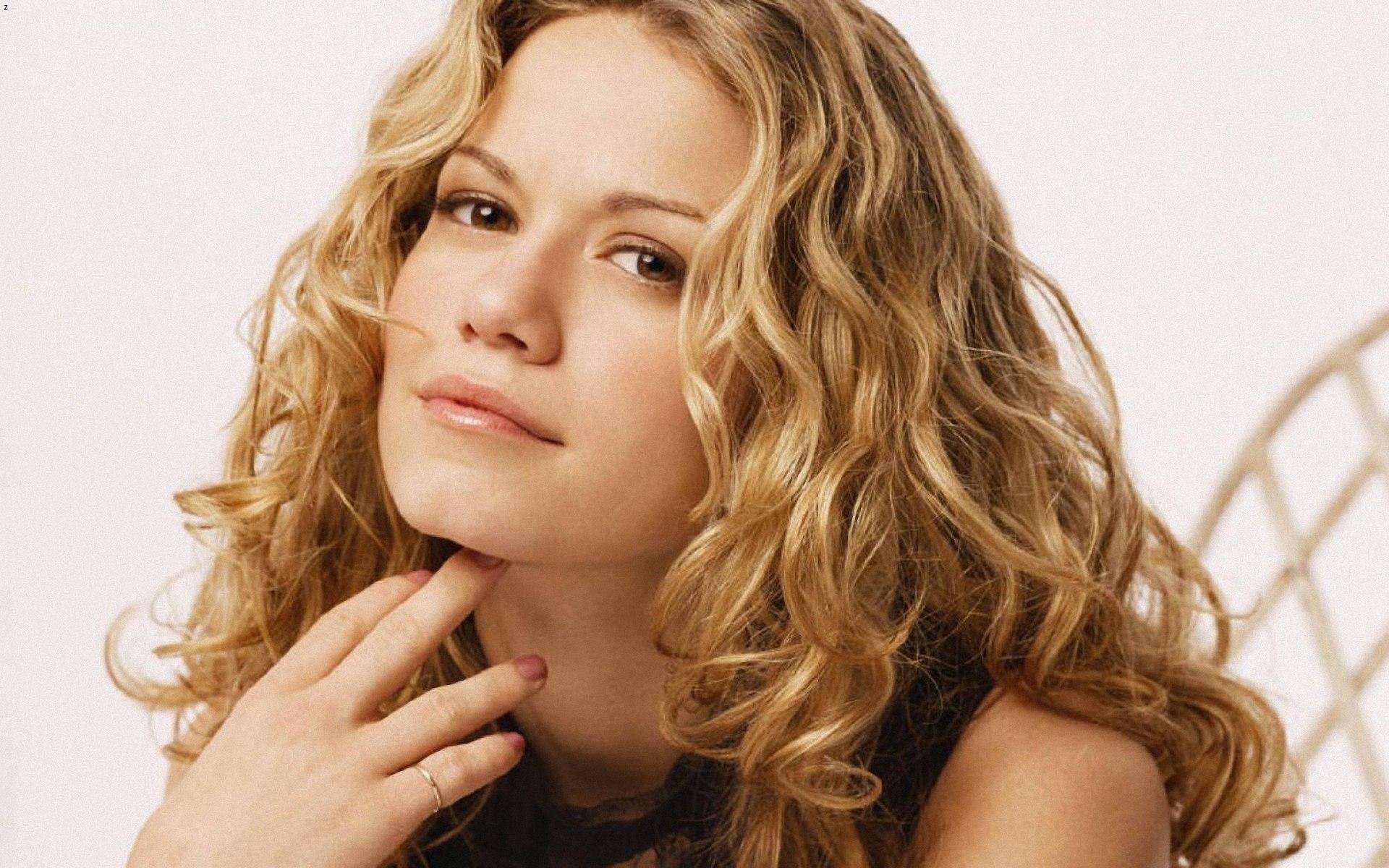 woman with curly blonde hair