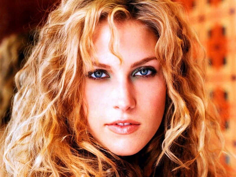 Woman with Curly Blonde Hair — Intense
