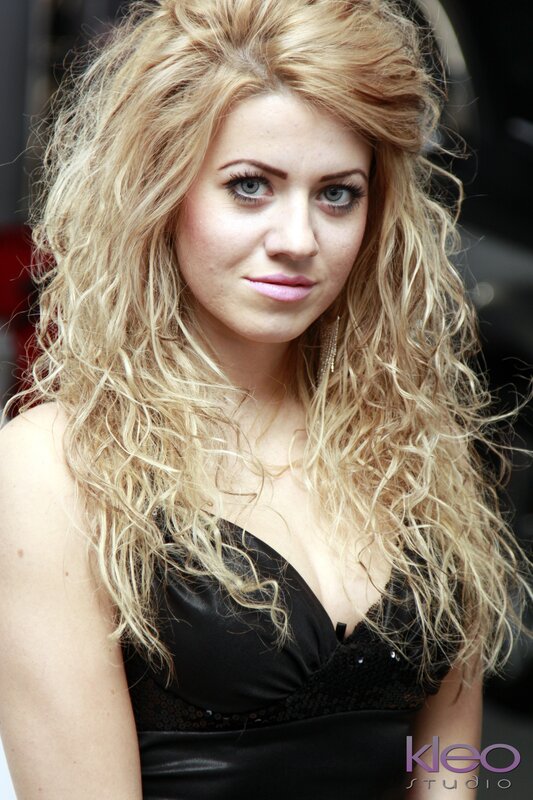 Woman with Curly Blonde Hair — Neutral, Photograph, Black Dress