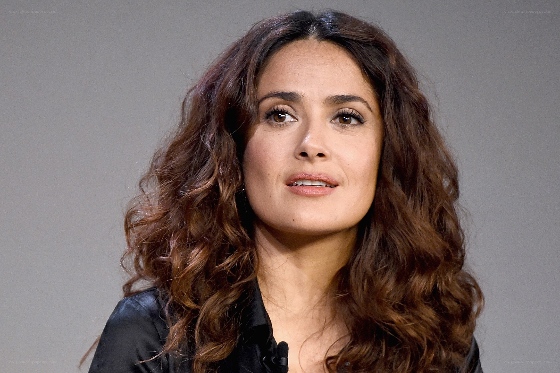 woman with curly brown hair