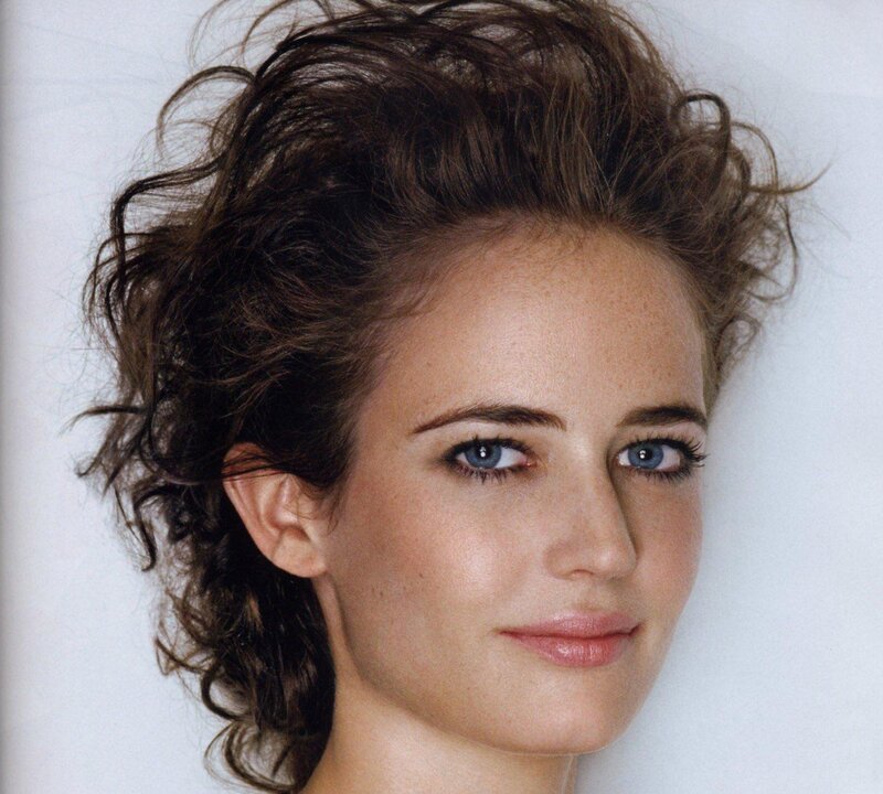 woman with curly hair and blue eyes
