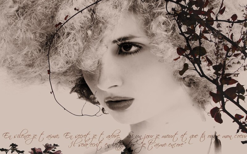 woman with curly hair and flowers