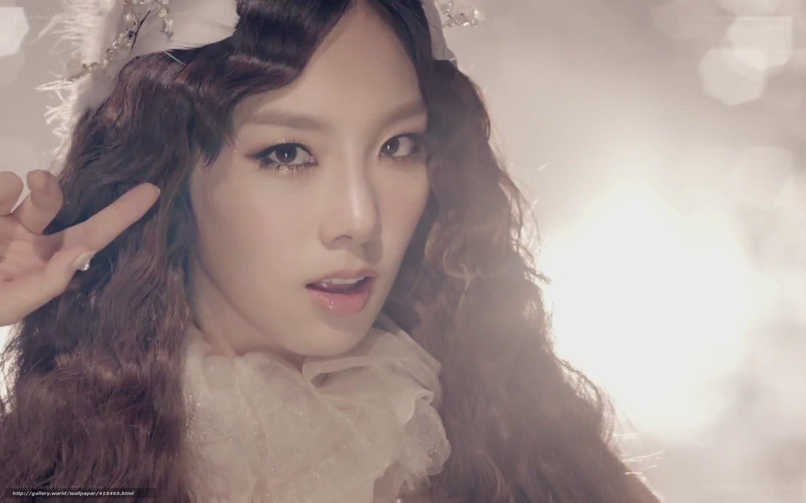woman with curly hair and headpiece