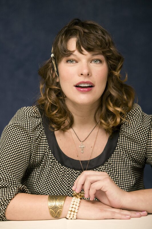 woman with curly hair and jewelry