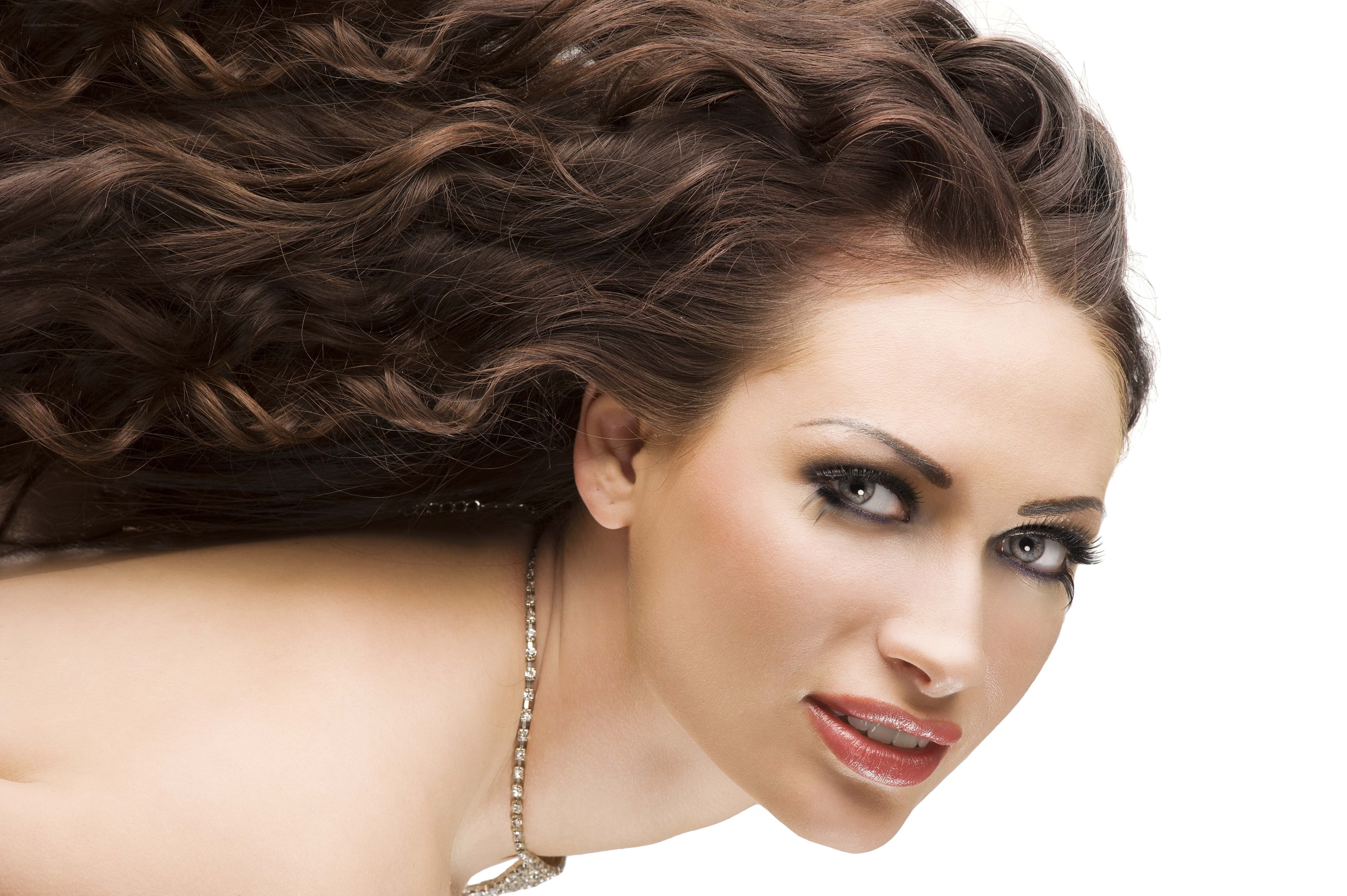 woman with curly hair and makeup