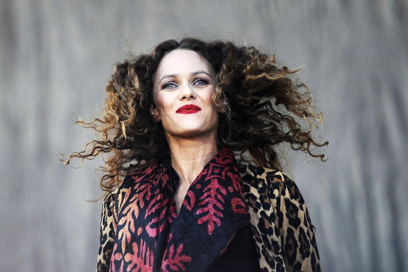 woman with curly hair and red lipstick