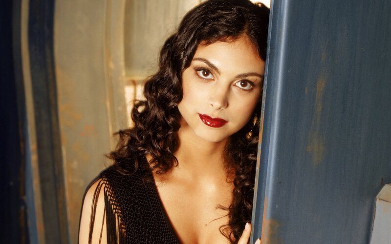 woman with curly hair and red lipstick