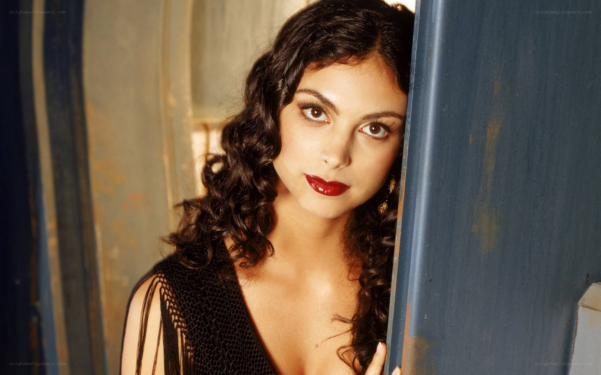 woman with curly hair and red lipstick