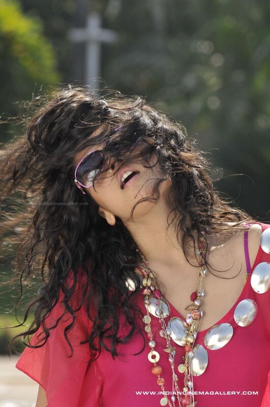 woman with curly hair and sunglasses