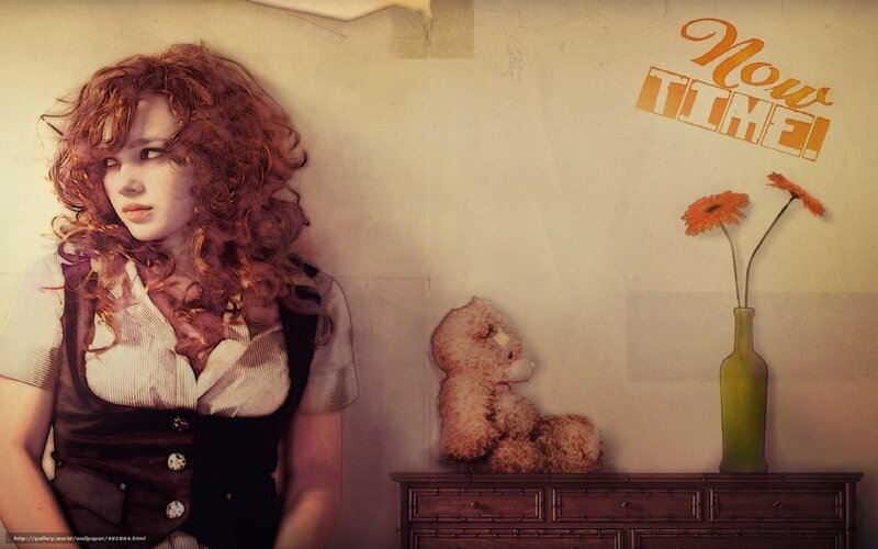woman with curly hair and teddy bear