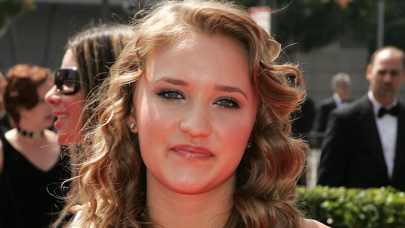 woman with curly hair at event