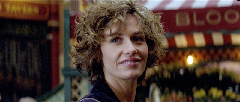woman with curly hair at market