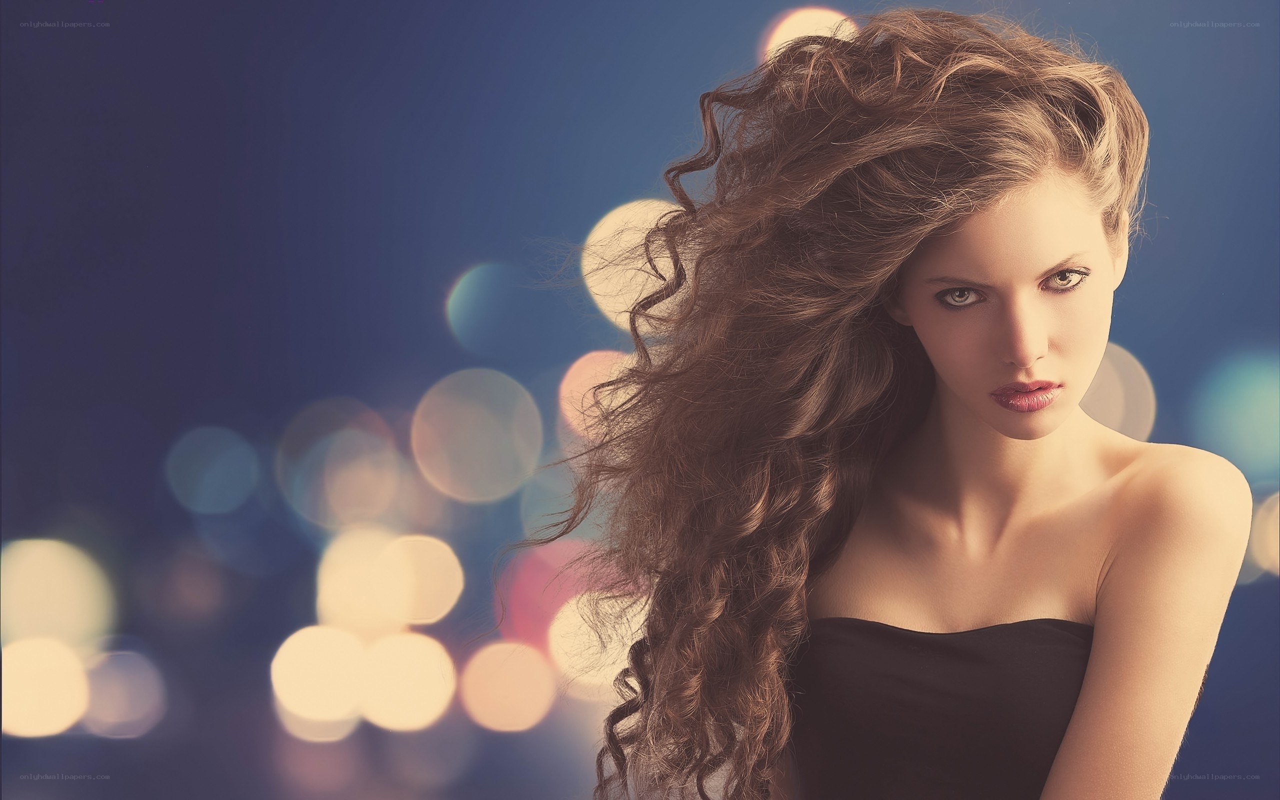 woman with curly hair at night