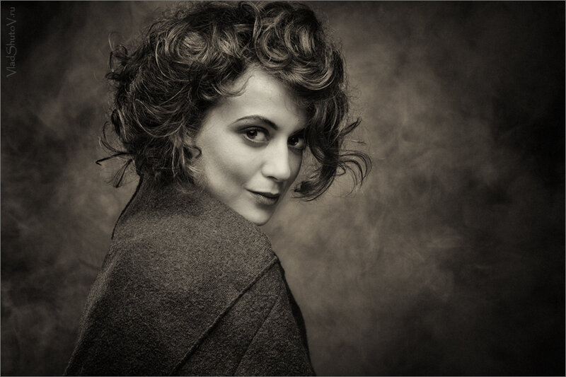 Woman with Curly Hair — Black, Dramatic, Photograph, Coat