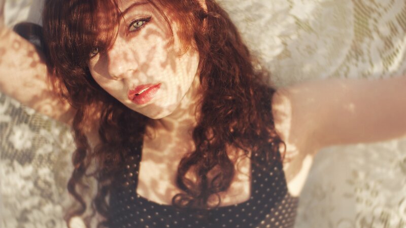 Woman with Curly Hair — Brown, Dramatic, Afternoon, Photograph, Polka Dot Top