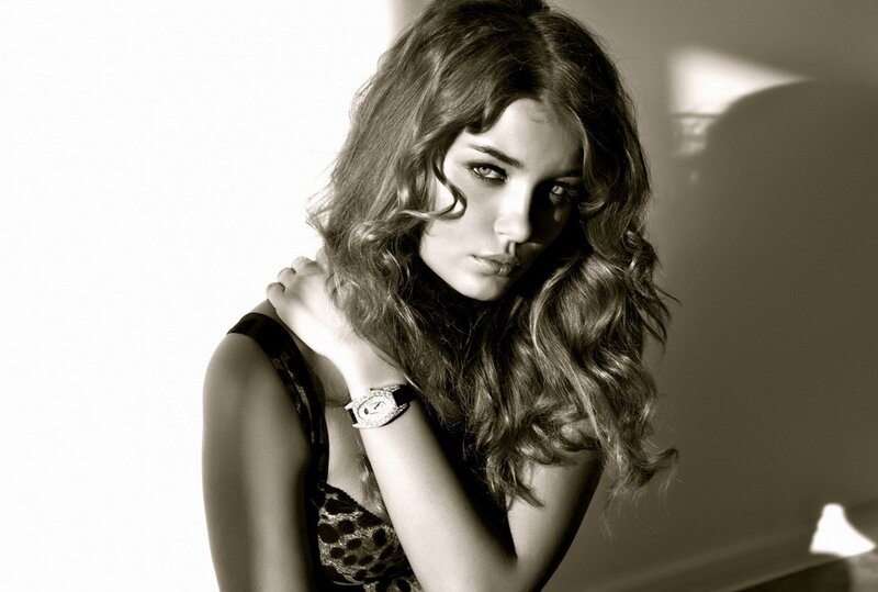 woman with curly hair in black and white