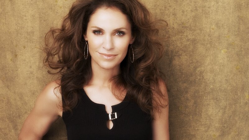 woman with curly hair in black top