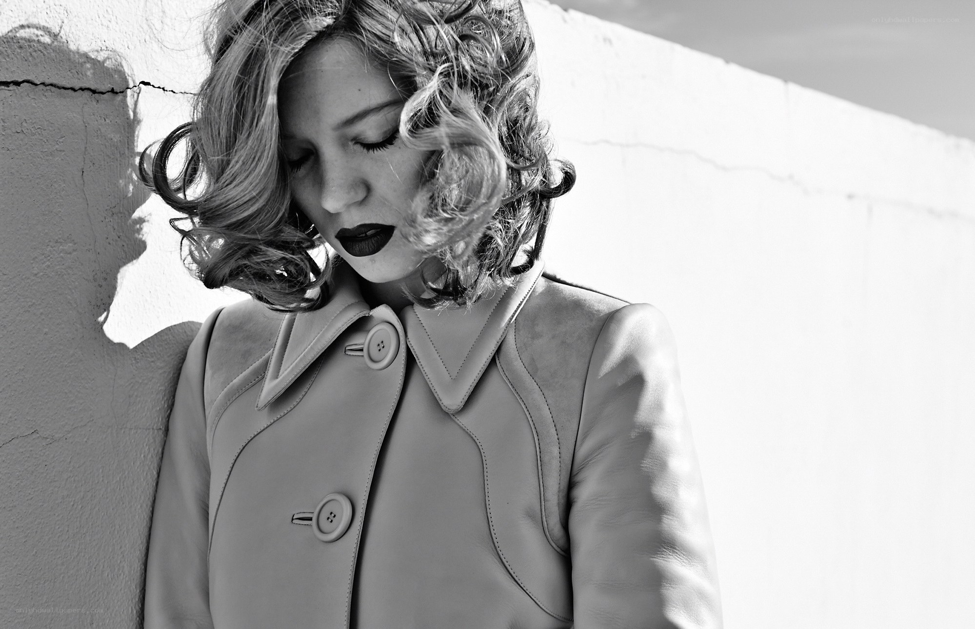 woman with curly hair in coat