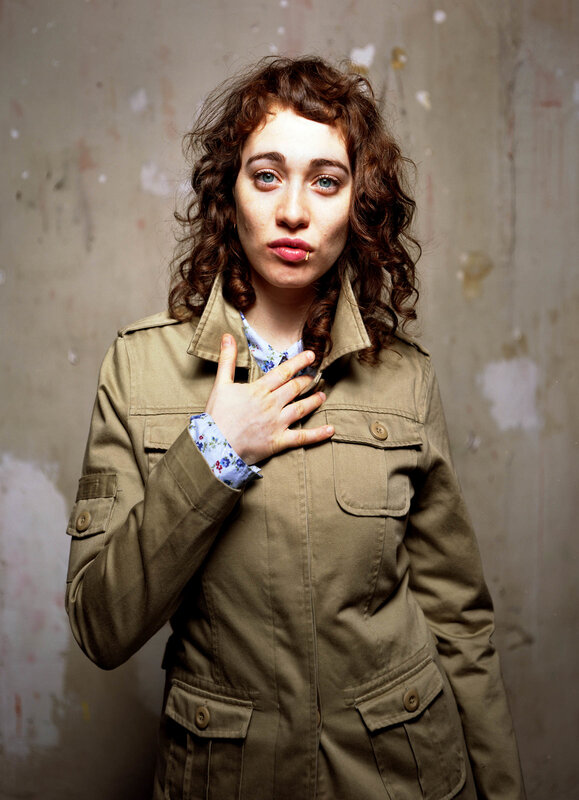 woman with curly hair in jacket
