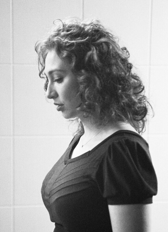 woman with curly hair in profile