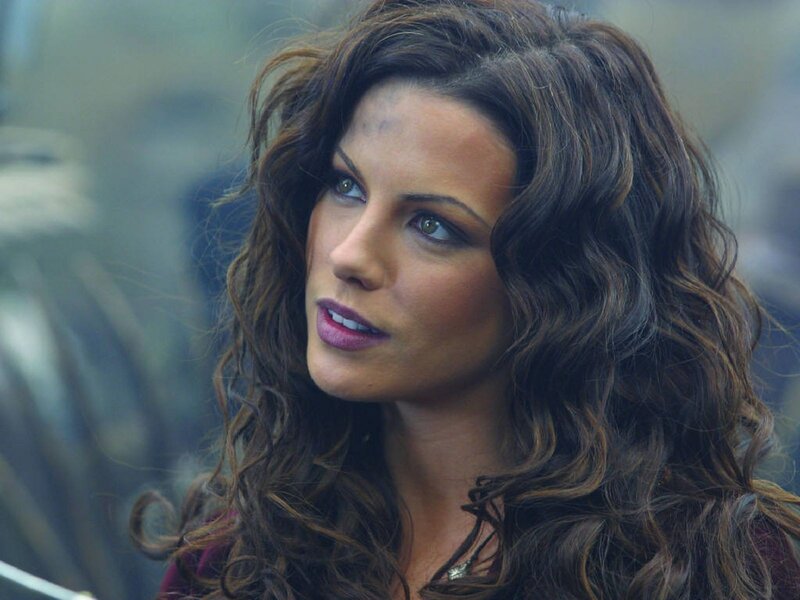 woman with curly hair looking away