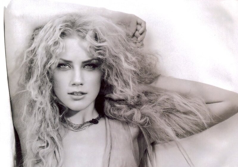 woman with curly hair lying down