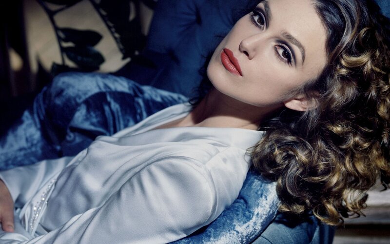 woman with curly hair lying down