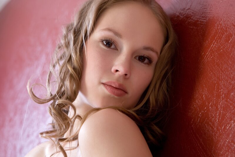 woman with curly hair lying down