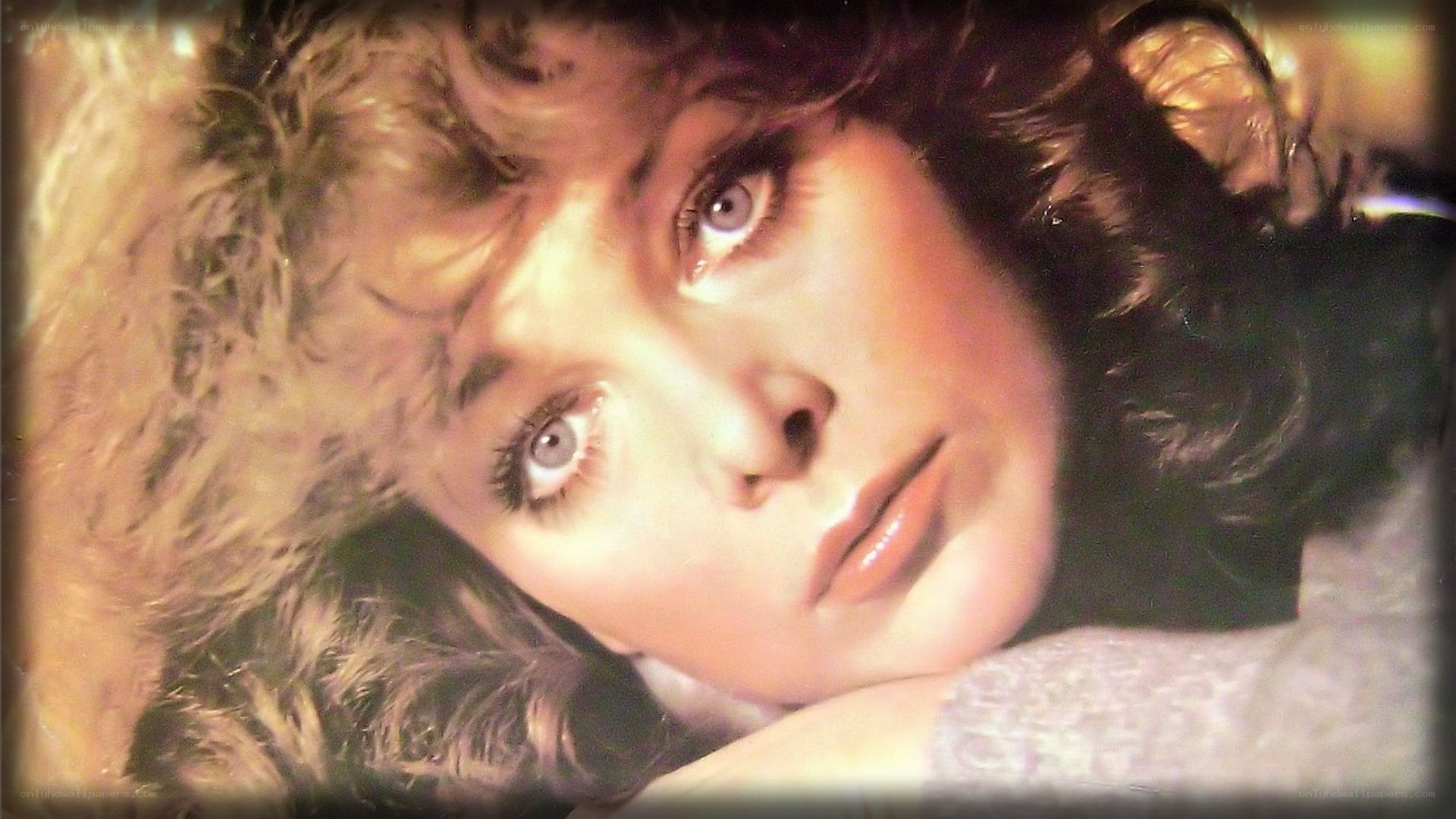 woman with curly hair lying down