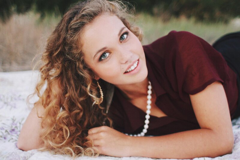 woman with curly hair lying down